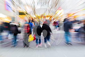 Walking people in the city with zoom effect