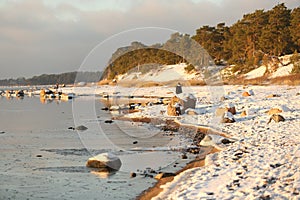 Walking people on the coast of sea at winter time