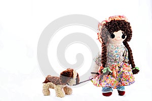 Heel Puppy, let`s go for a walk. New pose. Vintage girl rag doll with her puppy; presented on a plain white background.