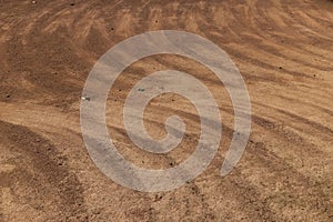 a walking red path made of rammed sand after sweeping