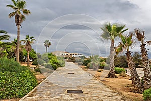 Walking road along the playa Sa Bassa des Cabots in gloomy weather. Colonia Sant Jordi. Mallorca island