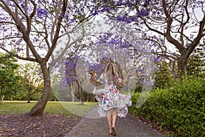 Walking among the rows of purple Jacaranda trees