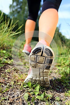 Walking or running legs in forest, adventure and exercising