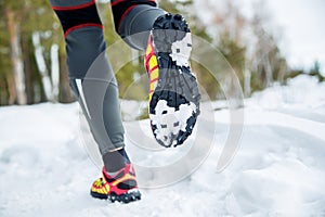 Walking or running legs sport shoes, fitness and exercising in autumn or winter nature. Cross country or trail runner outdoors