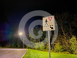 walking sign on side of road