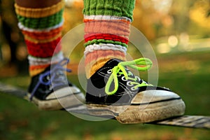 Walking the slackline in sneakers and colour socks