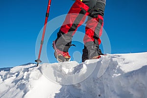 Walking on snow with Snow shoes and Shoe spikes in winter.