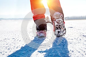 Walking on snow with Snow shoes and Shoe spikes in winter.