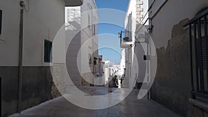 Walking through south italy village narrow streets of Vieste in Puglia - Italy