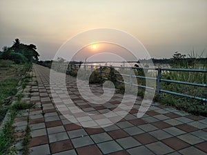 Walking street along the Mekong river with sunset in the evening.