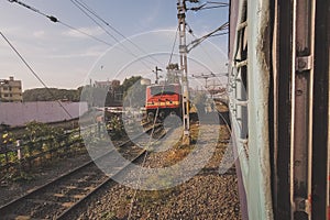 Walking between tracks with trains in india