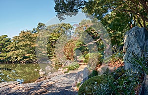 Walking trail around pond at the Ninomaru Garden at the Tokyo Imperial Palace. Tokyo. Japan