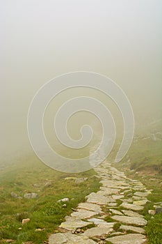 Walking trail hidden in fog close to Dumbier peak in Low Tatras mountain