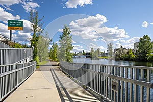 A walking trail path through the public city park near Cedar Street in the mountain town of Sandpoint, Idaho