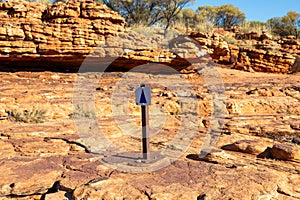 A walking trail sign in Kings Canyon, Red Center, Australia