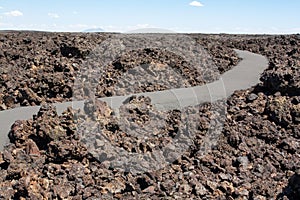 Walking among the volcanic rocks at Craters of the Moon National Monument and Preserve