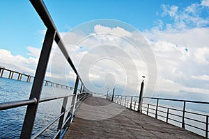 Walking way and Vasco da Gama bridge over Tagus river