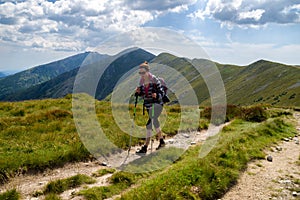 Walking woman hiking on the mountains