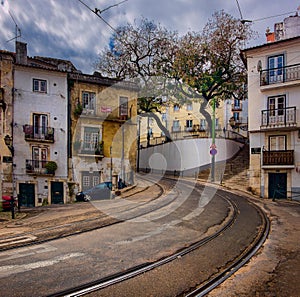 Walks on the way to the yellow Lisbon tram.