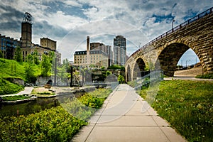 Walkwak and The Stone Arch Bridge at Mill Ruins Park, in downtown Minneapolis, Minnesota. photo