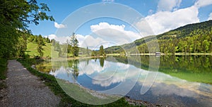 Walkway along lake Ferchensee at springtime, idyllic landscape near Mittenwald