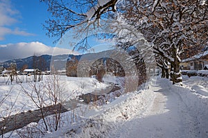Walkway along loisach river garmisch in winter