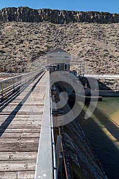 Walkway with handrail leads to the controller of a diversion dam photo