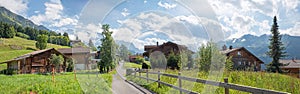 walkway through idyllic village Wengen, Bernese Oberland landscape switzerland