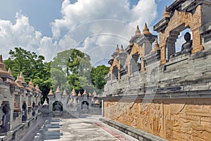 Walkway inside a huge complex of Chedi Hin Sai, sandstone stupas resembling Borobudur at Wat Pa Kung Temple, Roi Et, Thailand