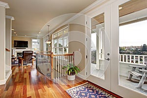 Walkway in luxury home with glass doors.