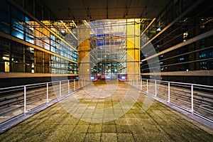 Walkway and modern building at night, at La DÃÂ©fense, in Paris,