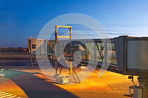 Walkway for passengers boarding at airoport. sleeve at the airport for boarding an airplane night shoot in Tallinn