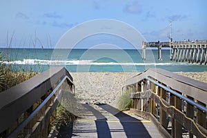 The walkway to the beach at Venice, Florida pier on a sunny day.