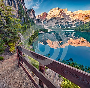 Walkway trekk around Braies Pragser Wildsee lake.