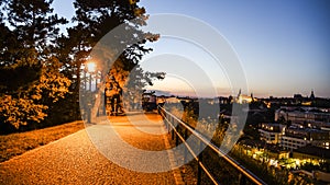 Walkway on Vysehrad fortification walls illuminated by street lamps by night. Prague, Czech Republic