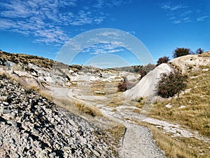 A walkway through white sandstone formations at St Bathans in New Zealand