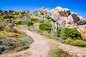 Walky path between bizarre granite rock formations in Capo Testa, Sardinia, Italy