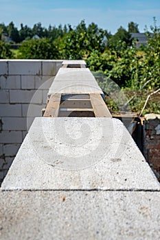 Wall of aerated concrete blocks, window lintels, top view. Laying aerated concrete blocks.