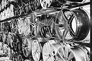 wall of alloy car wheels in store