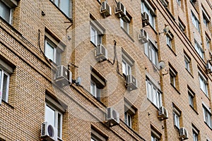 The wall of an apartment house with air conditioning