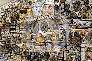Wall of art objects, knick knacks, and tourist items for sale in Cancun, Mexico. photo