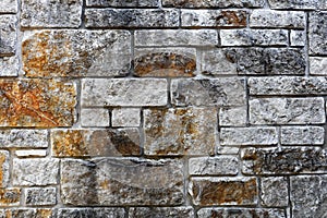 Wall background with various sized stone slabs