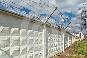 Wall with barbed-wire with electricity.