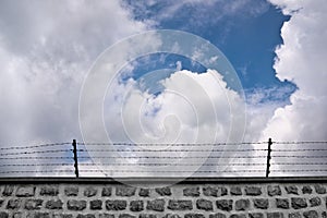 Wall and barbwire