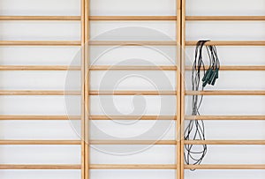 Wall bars and jump rope in the school gymnastic hall