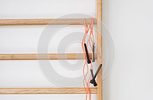 Wall bars and jump rope in the school gymnastic hall