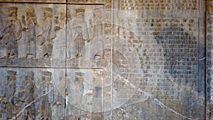 Wall of bas relief carvings of soldiers at Persepolis