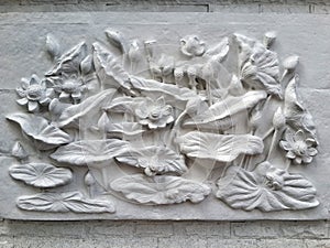 Wall bas-relief stucco in plaster, depicts Lotus flowers.