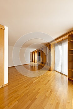 Wall bookcase in empty room