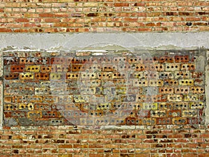 A wall of brick with a different type of masonry.